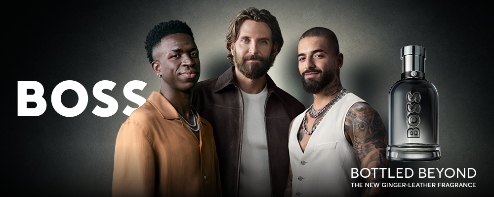 Reklambanner för parfymen BOSS med Bradley Cooper, Maluma och Vinícius Júnior samt texten 'The new Ginger-leather fragrance'.